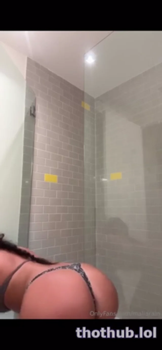 Malia Rain Remove her top to show tits