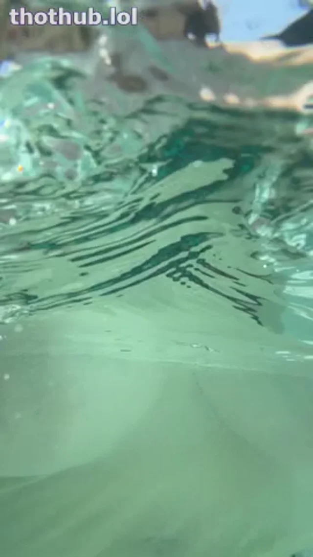 KIRA SOAKS IN HER POOL