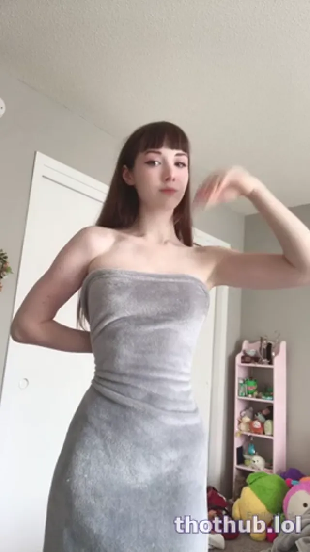 Emi posing naked with grey blanket