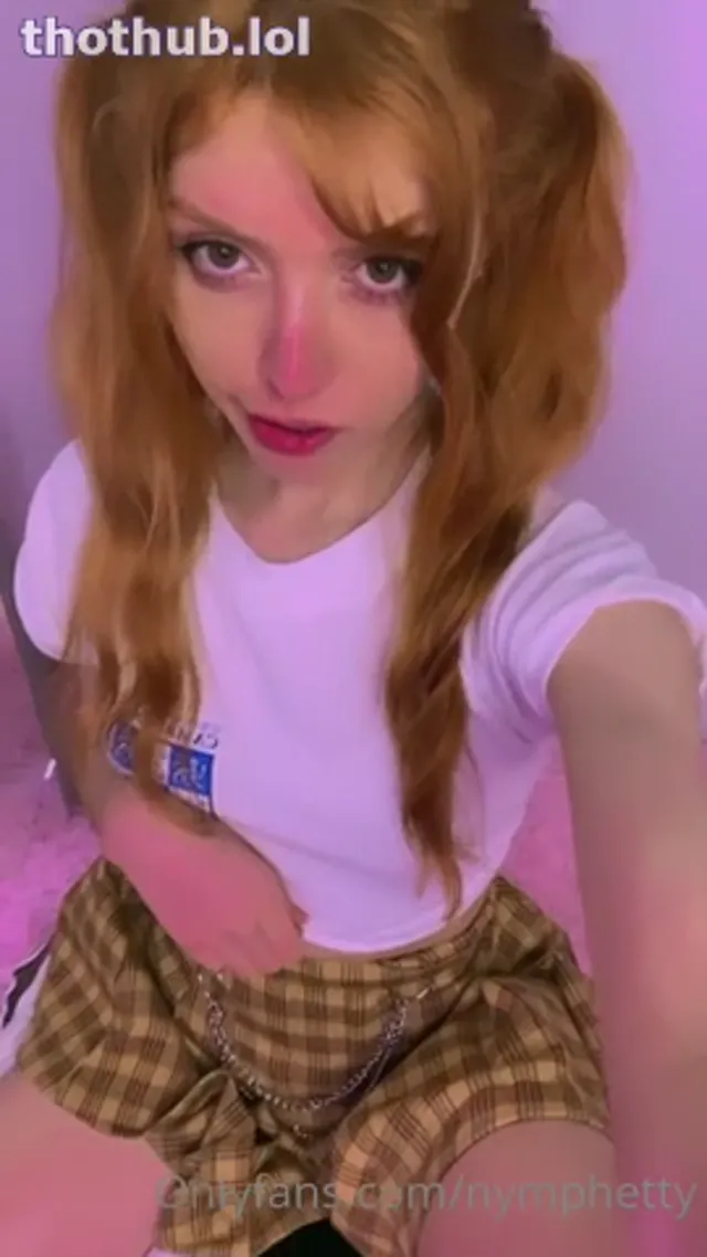 Nymphetty lifts up her white top