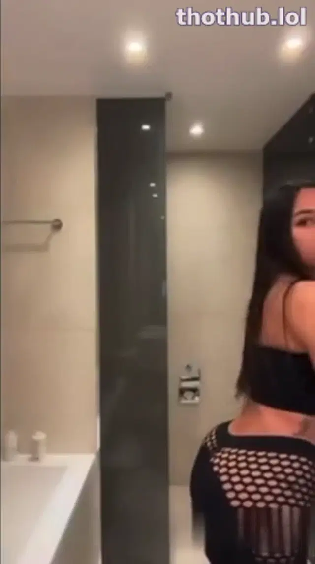 Astrid nelsia in black playing with herself