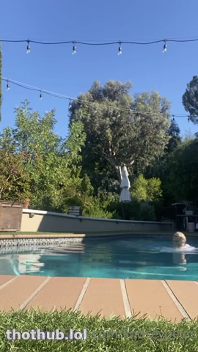 Lindsey Pelas shows big boobs in the pool