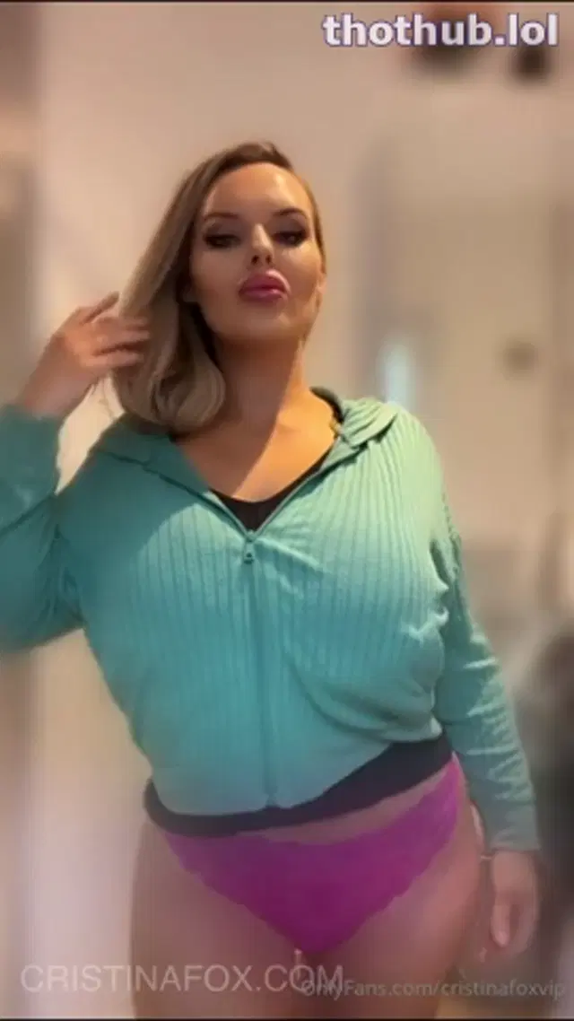 Cristina Fox takes sweater off