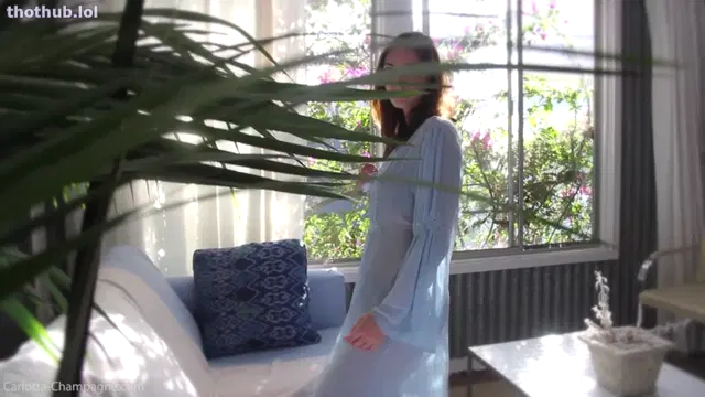 Carlotta Champagne – strips out of see-thru robe & lingerie in the sun-room