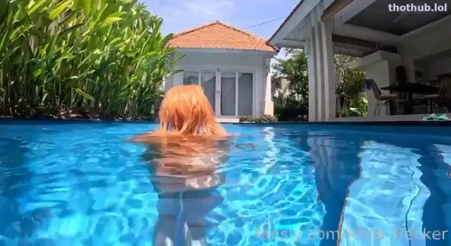Alina Becker swimming naked in the pool